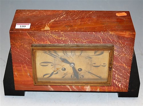 Lot 100 - An Art Deco marble cased mantel clock, having...
