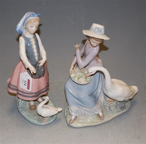 Lot 114 - A Lladro porcelain figure of a girl feeding a...