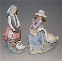Lot 114 - A Lladro porcelain figure of a girl feeding a...