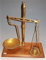 Lot 118 - A Victorian brass beam scale, with weights and...