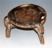 Lot 137 - A 19th century African hardwood tribal stool...