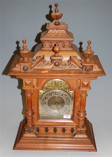Lot 107 - A circa 1900 German walnut cased mantel clock,...