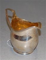 Lot 257 - A George III silver helmet shaped cream jug,...