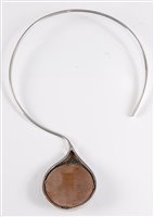 Lot 159 - A silver and tigers eye torque necklace, the...