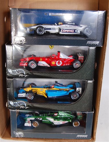 Lot 2614 - Four various boxed Hotwheels 1/18 scale F1...