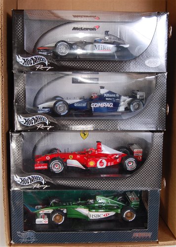 Lot 2615 - Four various boxed Hotwheels 1/18 scale F1...