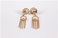 Lot 2546 - A pair of '18k' tassel earrings, the three...