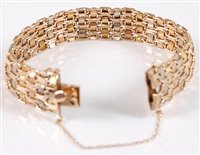Lot 1211 - A tri-coloured gold bracelet, the alternating...