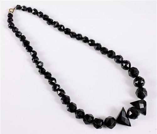 Lot 2573 - A jet bead necklace, the graduated faceted...