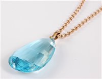 Lot 2530 - An aquamarine pendant and 9ct chain, the large...