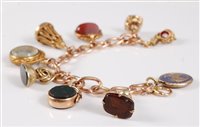 Lot 1178 - A 9ct bracelet and a selection of fobs, the...