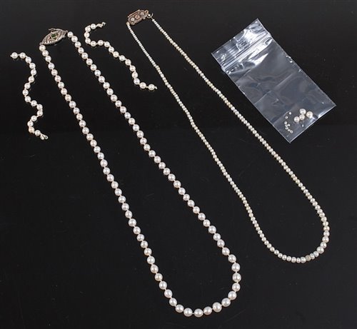 Lot 2511 - Two cultured pearl necklaces with diamond set...