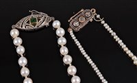 Lot 2511 - Two cultured pearl necklaces with diamond set...