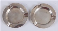 Lot 122 - A pair of Art Deco silver circular ashtrays,...