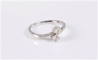 Lot 2525 - An 18ct white gold diamond crossover ring, the...