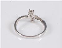 Lot 2525 - An 18ct white gold diamond crossover ring, the...