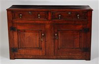 Lot 1587 - An early 18th century joined oak dresser base,...