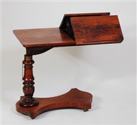 Lot 1588 - A Victorian rosewood bed table, having...