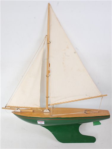Lot 26 - A wooden and tinplate model of a sailing yacht...
