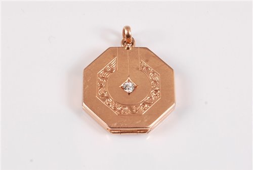 Lot 302 - A diamond set locket, the octagonal hinged...