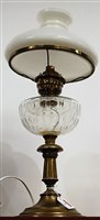 Lot 6 - An early 20th century oil lamp, having...