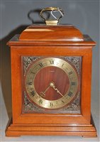 Lot 9 - A modern Smith's mahogany cased mantel clock,...