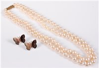 Lot 313 - A two strand cultured pearl necklace, the...