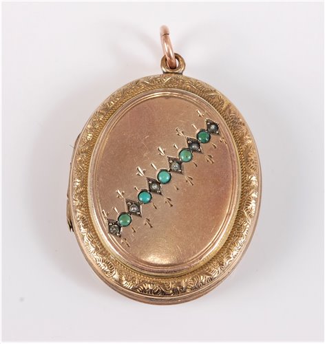 Lot 318 - An unmarked oval locket set with small...