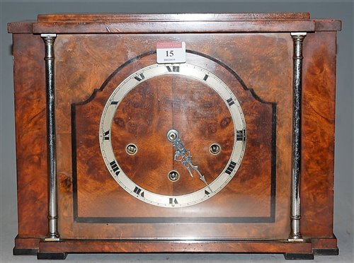 Lot 15 - An Art Deco walnut cased mantel clock, having...