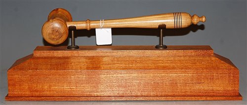 Lot 28 - An oversized turned sycamore gavel, raised on...