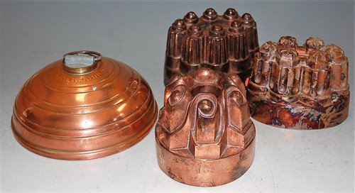 Lot 35 - Three Victorian copper castle-top jelly moulds;...