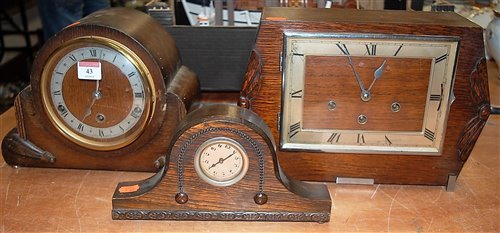 Lot 43 - An Art Deco oak cased mantel clock having...