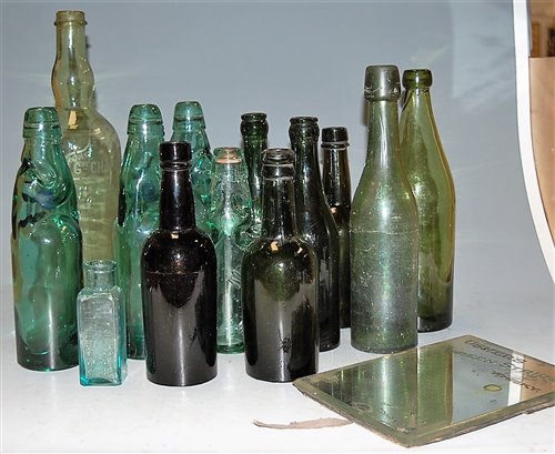 Lot 56 - A box of miscellaneous glass bottles to...