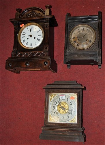 Lot 87 - A late 19th century pine cased mantel clock by...