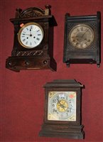 Lot 87 - A late 19th century pine cased mantel clock by...