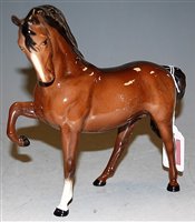 Lot 173 - A Beswick model of a horse, having head down...