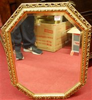 Lot 1069 - A gilt framed and bevelled octagonal wall...