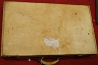 Lot 1079 - A vintage vellum suitcase with brass fittings