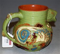 Lot 184 - A Devonware art pottery mottoware jug, the...