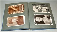 Lot 353 - A postcard album and contents, largely being...