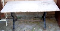 Lot 1122 - A marble topped and cast iron based low garden...