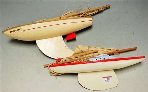 Lot 378 - Two childs painted wooden pond yachts, late...