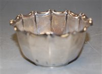 Lot 210 - A George V silver sugar bowl of fluted form