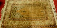 Lot 1135 - A Persian woollen prayer rug, 132 x 91.5cm