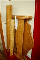 Lot 1150 - A modern pine double bedstead, having side...