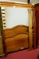 Lot 1153 - A French mahogany double lit-en-bateau, having...
