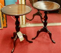Lot 1162 - A pair of reproduction mahogany circular...
