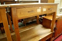 Lot 1166 - An early 20th century light oak two drawer...