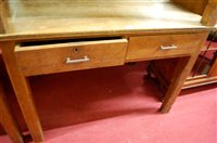 Lot 1167 - An early 20th century light oak two drawer...