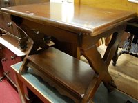 Lot 1190 - An oak two tier X-framed occasional table,...
